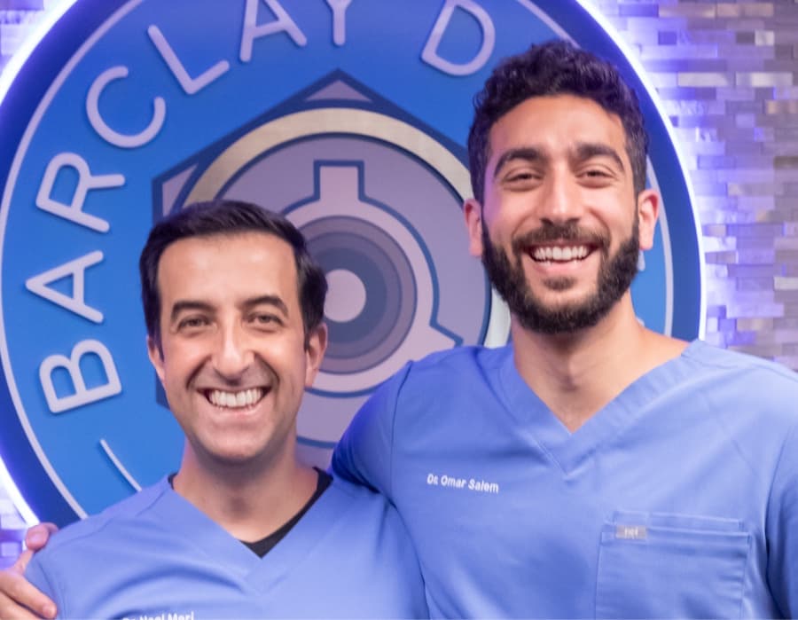 doctors at Barclay Dental smiling and laughing